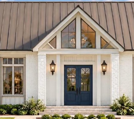 Detail of the clubhouse concept rendering: the navy double front door under a glass gable, flanked by lantern sconces.